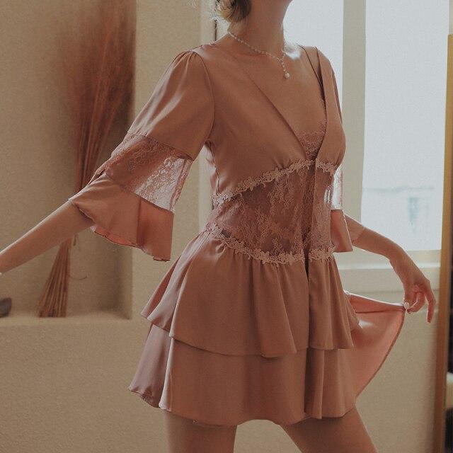 Lace-trimmed blush pink nightdress with flared sleeves and layered skirt, perfect for an elegant night in.