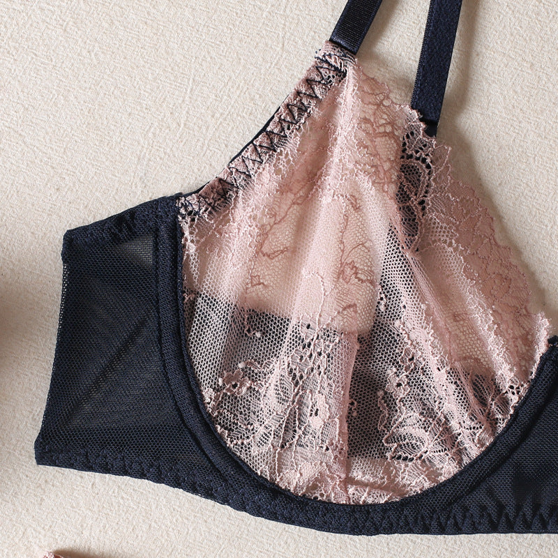 Lace bralette featuring a delicate pink lace overlay and breathable black mesh fabric, designed for comfort and style, ideal for layering or wearing on its own