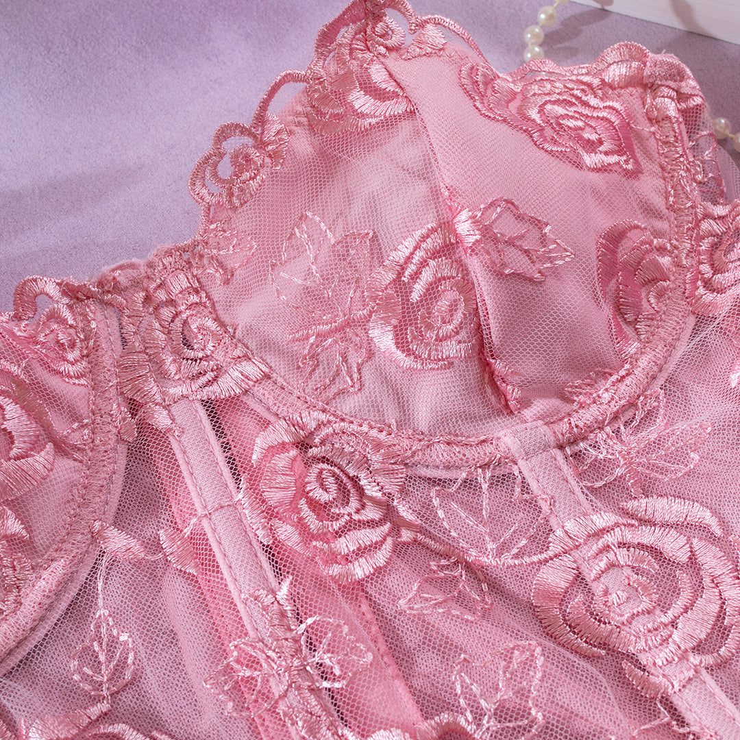 Delicate pink lace lingerie featuring intricate embroidered rose patterns, designed for a romantic and feminine touch. Perfect for special occasions or everyday elegance, showcasing high-quality