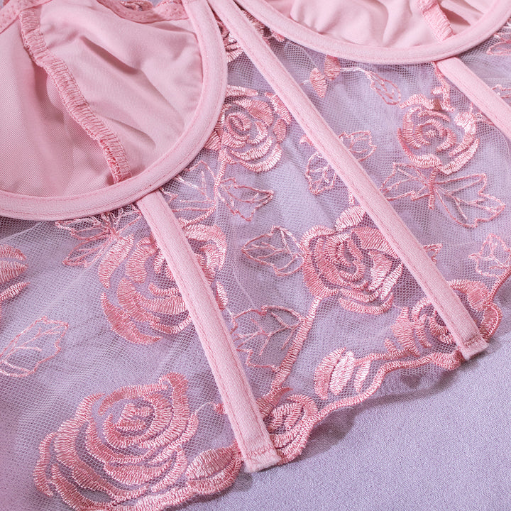 Delicate pink embroidered lace bralette featuring floral designs, soft mesh detailing, and elegant straps, perfect for an enchanting lingerie collection. Ideal for adding a