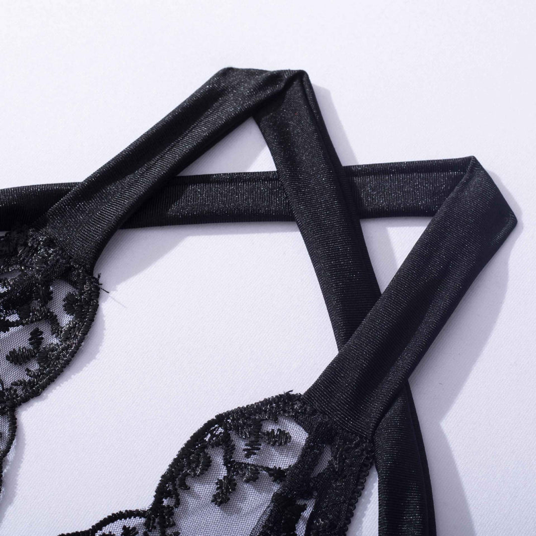Black lace bra with adjustable satin straps, showcasing intricate floral detailing.