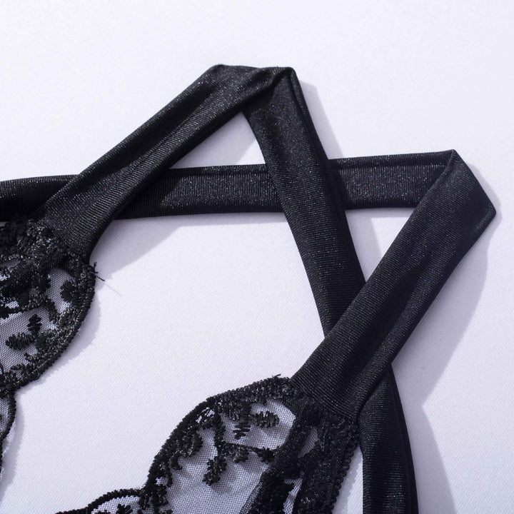 Black lace bra with adjustable satin straps, showcasing intricate floral detailing.