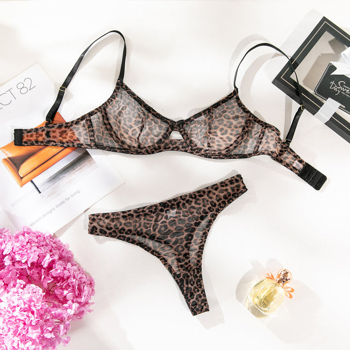 Leopard print sheer lingerie set featuring a bra and matching thong, styled with delicate straps and intricate detailing.