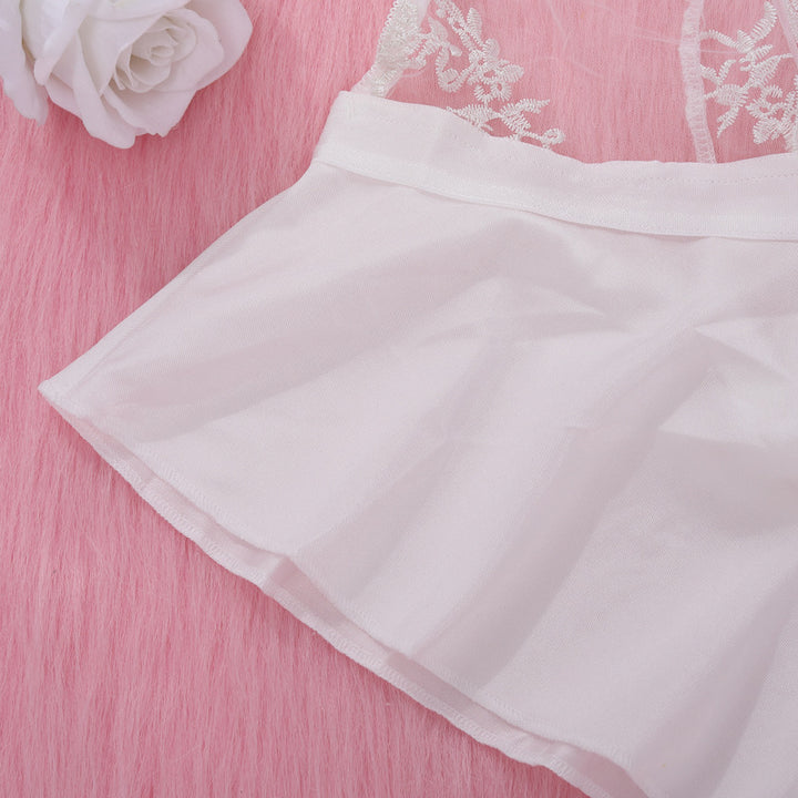 White lingerie with floral lace detailing, featuring a soft, flowing skirt style, displayed on a pink background.