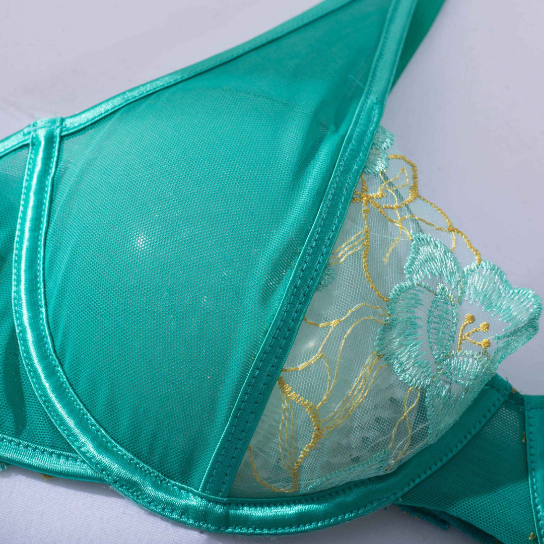 Elegant teal lace bra featuring delicate floral embroidery and sheer mesh fabric, perfect for combining comfort and style in women's lingerie collections. Ideal for everyday wear or special