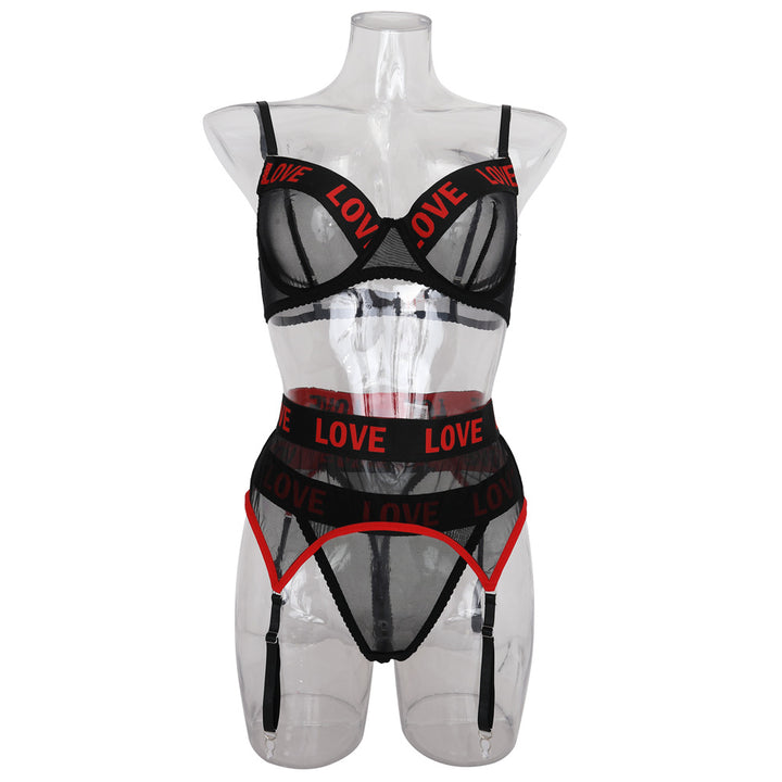 Black mesh lingerie set with red "LOVE" lettering, featuring a bra with adjustable straps, matching high-waisted panties, and a garter belt.