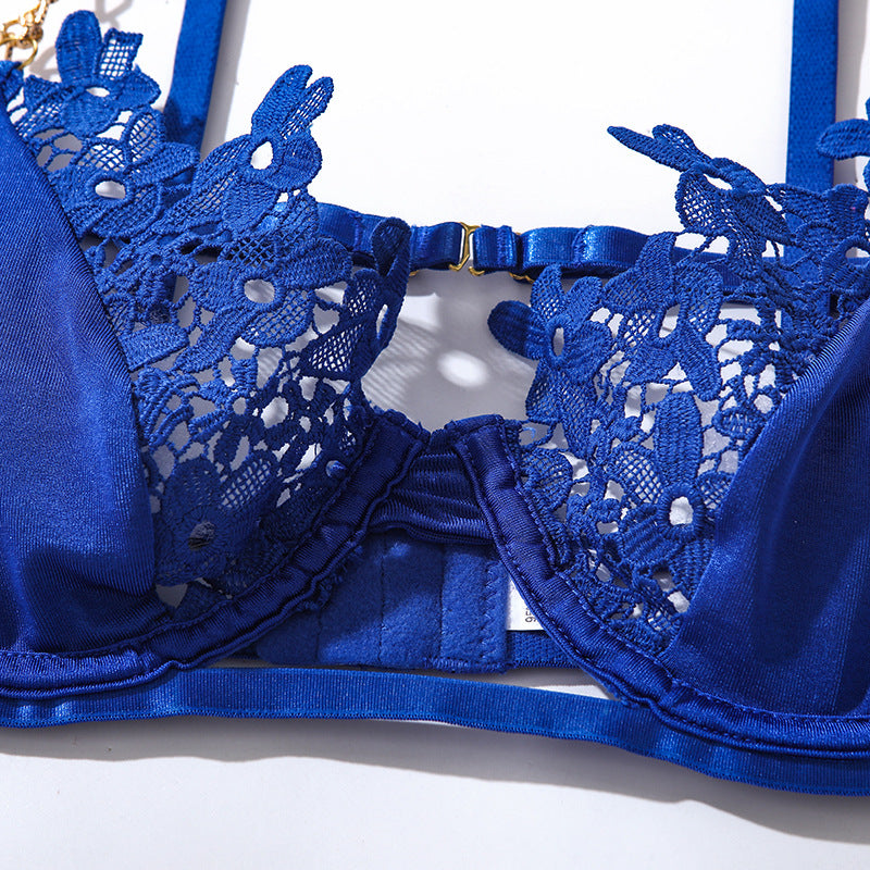 Luxe blue lingerie bra featuring intricate floral lace detailing, adjustable satin straps, and a comfortable underwire design. Perfect for special occasions or everyday wear,