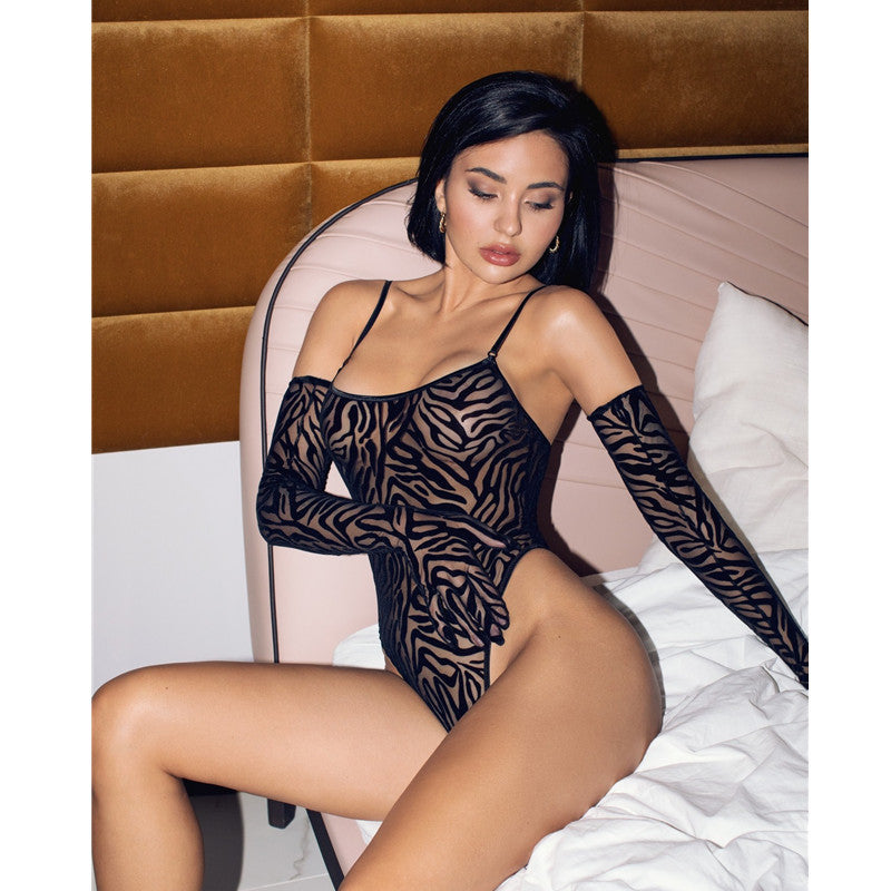 Black sheer lingerie bodysuit with a stylish zebra print design, featuring long sleeves and a low-cut neckline. The model is posed elegantly on a bed