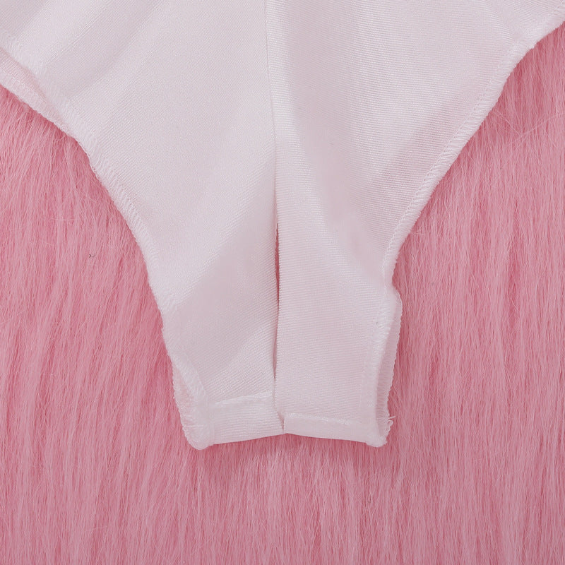 White lace thong lingerie on a pink fur background.