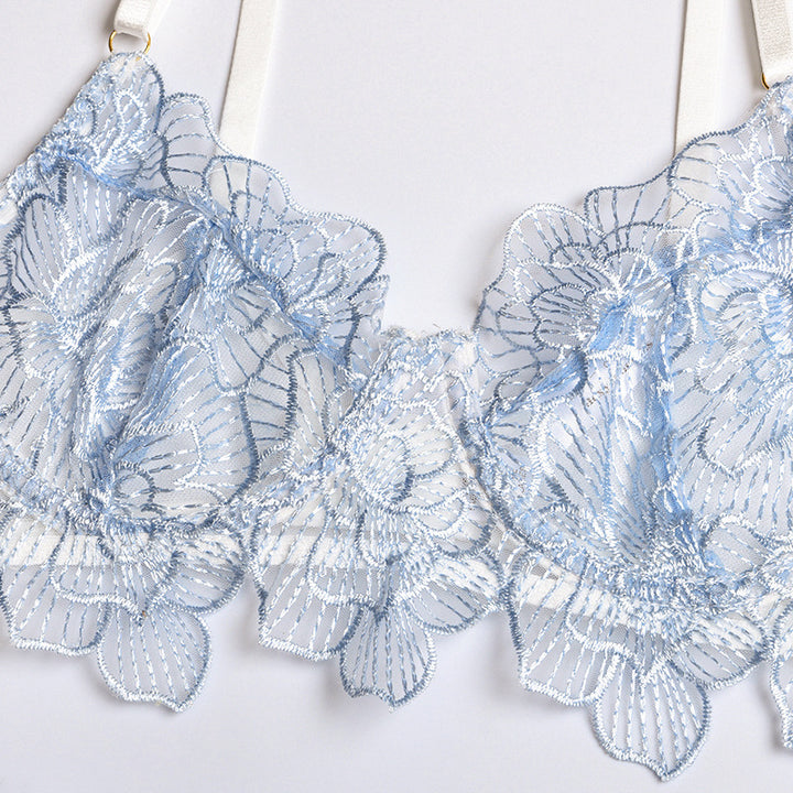 Light blue lace bra with intricate floral embroidery and elegant detailing.