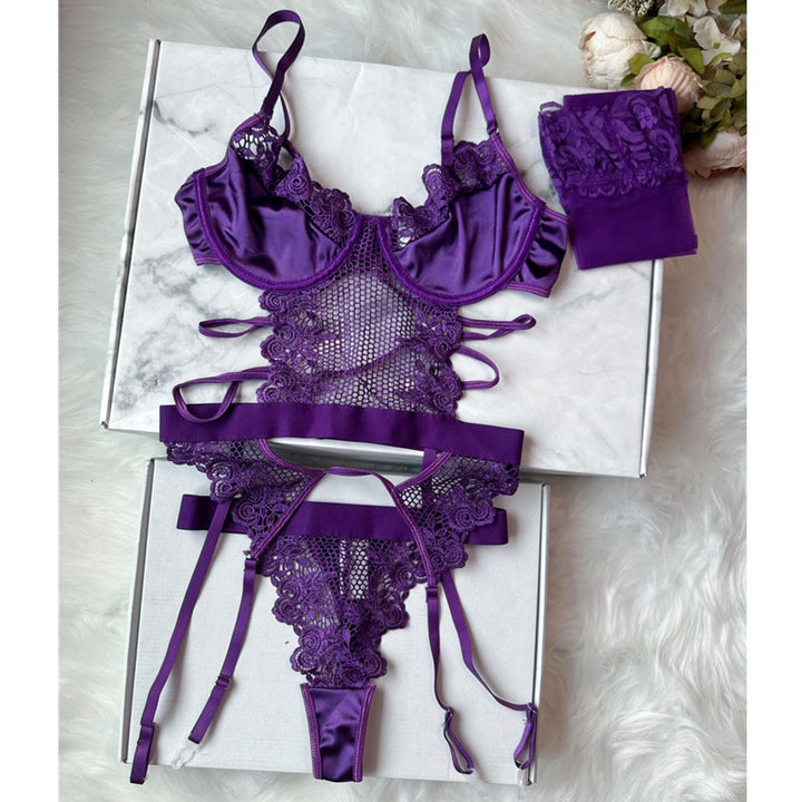 Purple lace lingerie set featuring a satin bralette with delicate ruffles, intricate lace detailing, and adjustable straps, complemented by a matching sheer thong and a