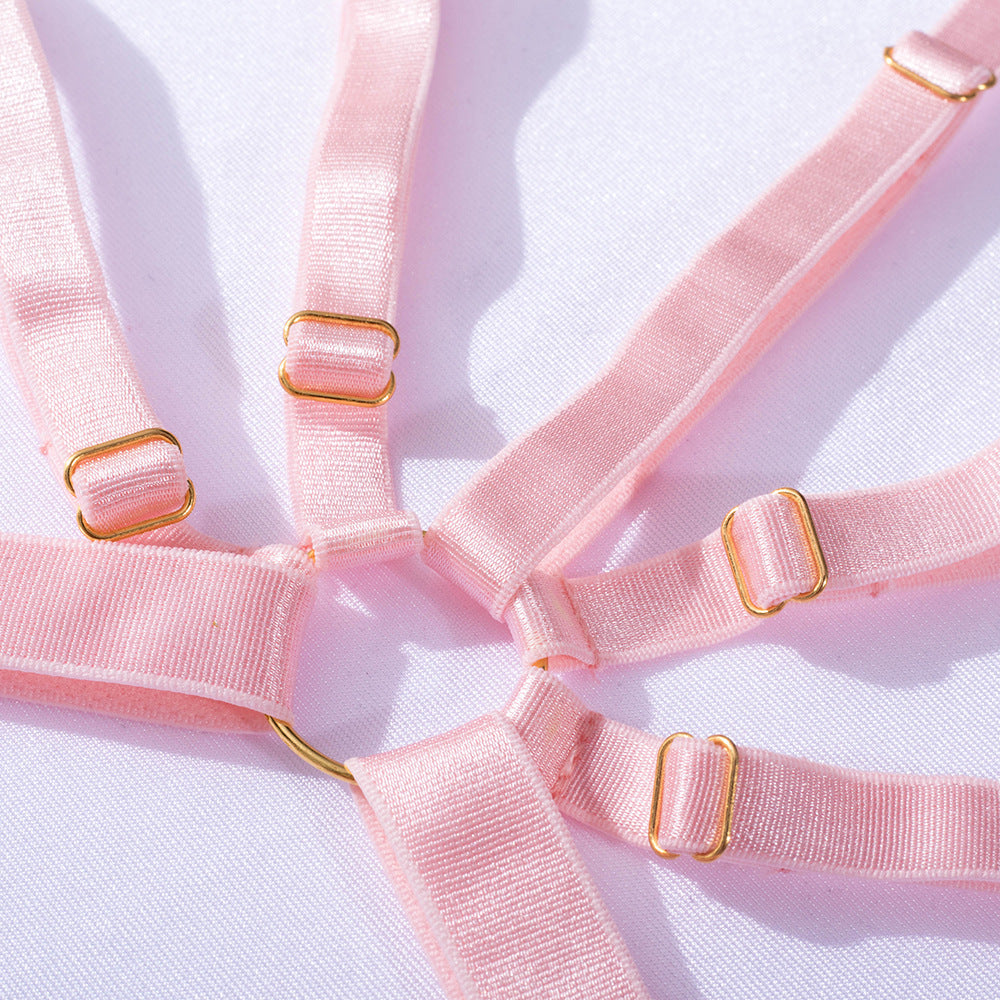 Pink lingerie straps with gold accents arranged elegantly on a white background, showcasing the soft fabric and delicate design, ideal for enhancing your intimate wear collection. Perfect