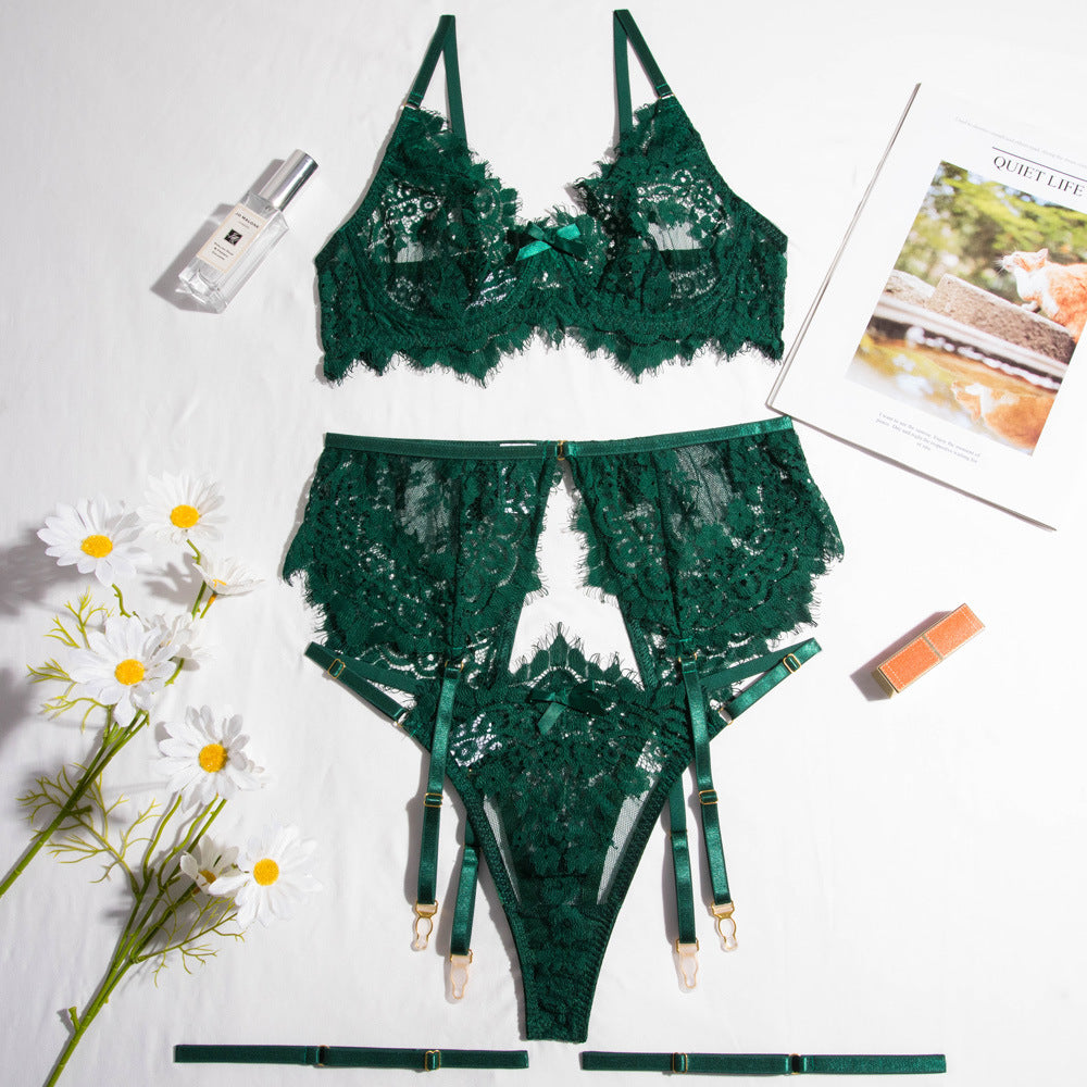 Elegant green lace lingerie set featuring a delicate bralette with adjustable straps and a matching high-waisted garter belt. The ensemble includes chic lace detailing,