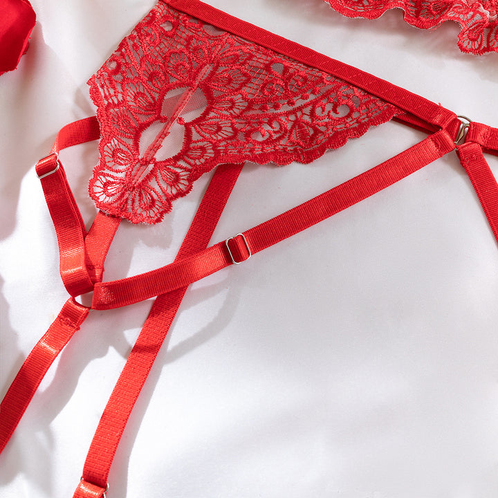 Red lace lingerie set with adjustable straps and intricate floral detailing, perfect for a seductive look.