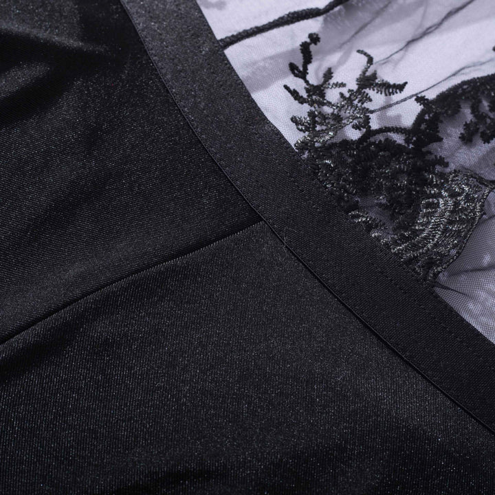 Black lingerie featuring intricate lace detailing on sheer fabric, highlighting elegance and sophistication.