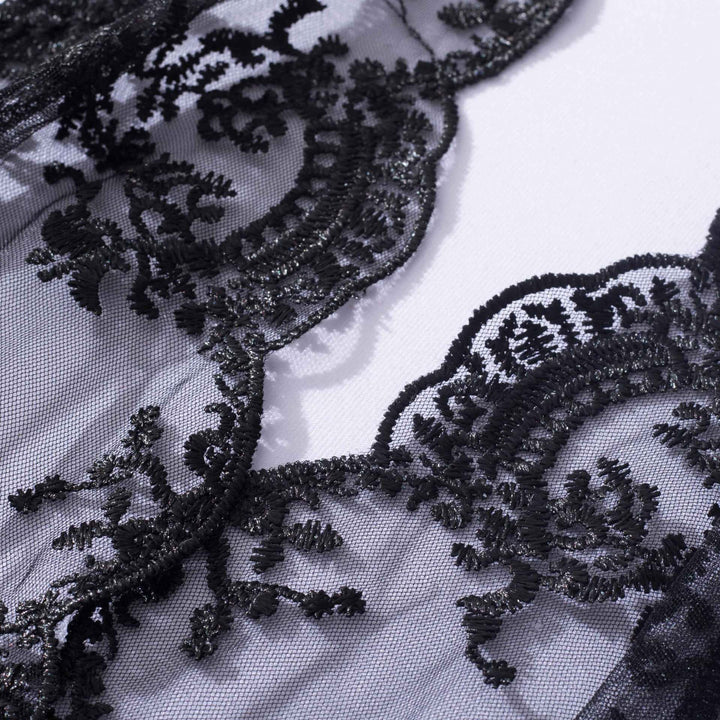 Delicate black lace fabric featuring intricate floral embroidery, perfect for elegant lingerie and nightwear collections.