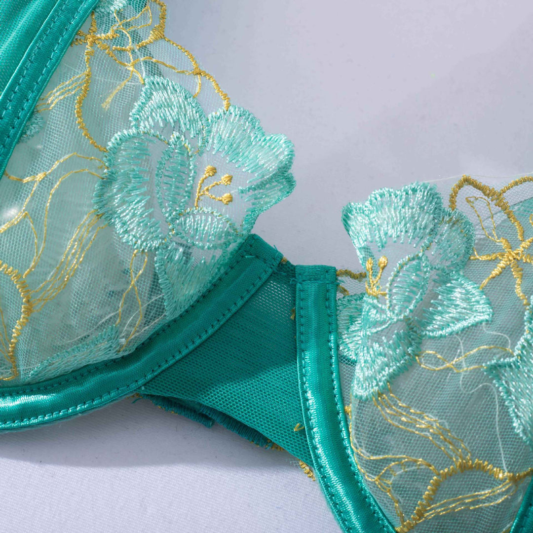 Teal lace lingerie bra featuring intricate floral embroidery in shades of mint and gold, designed for elegance and comfort. Ideal for enhancing your intimate wear collection,