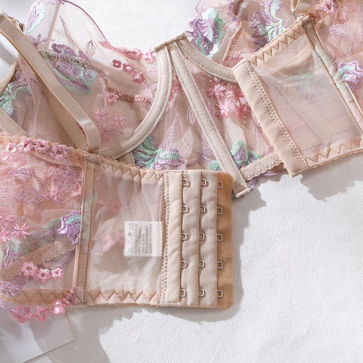 Delicate floral lace lingerie bra with intricate embroidery in pastel colors, featuring adjustable straps and a hook-and-eye closure for a comfortable fit. Perfect addition to