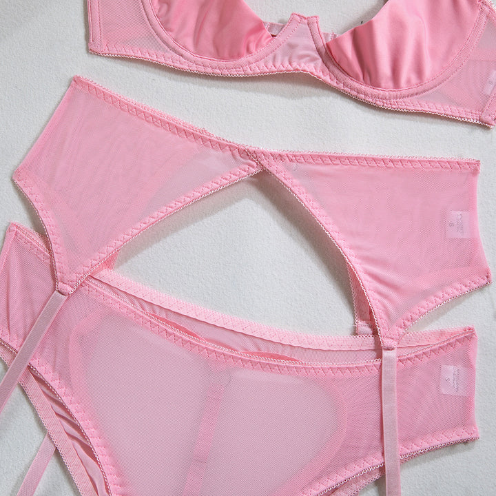 Pink lingerie set featuring a delicate sheer bra and matching high-waisted panties, designed for comfort and elegance. The fabric has a soft, lightweight texture,