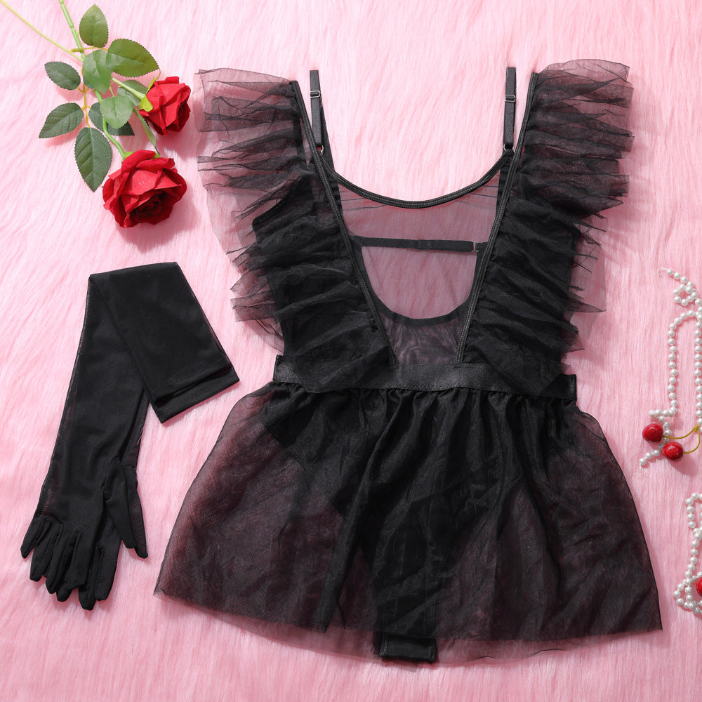 Black sheer lingerie set featuring a ruffled top and matching black gloves, elegantly displayed on a soft pink background alongside red roses, perfect for intimate occasions or