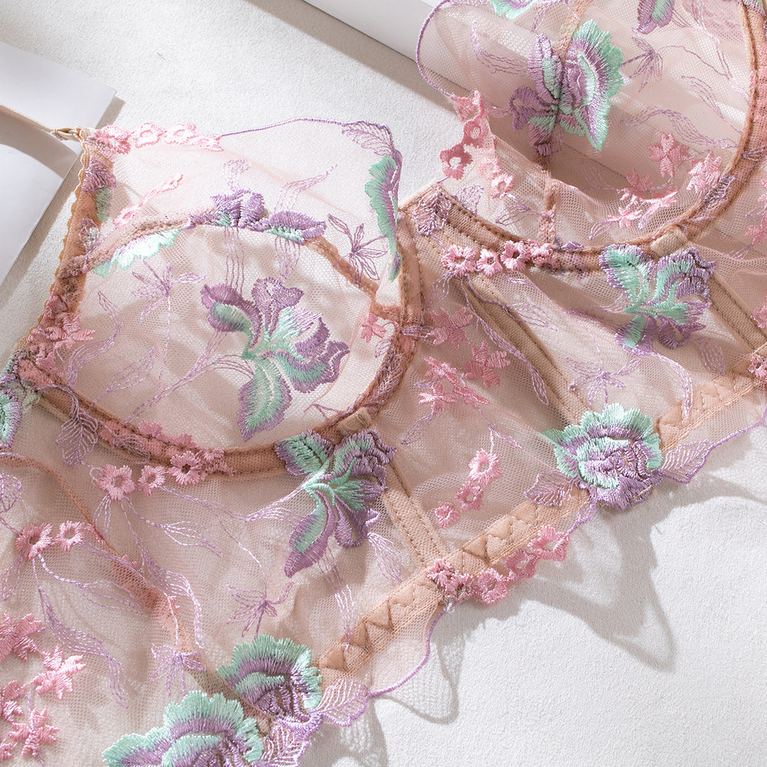 Lacy sheer lingerie featuring intricate floral embroidery in pastel pink and green hues, designed for elegance and comfort, perfect for special occasions or everyday wear. Ideal