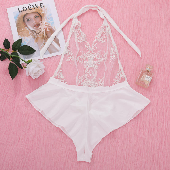 White lace lingerie set featuring a sheer bodice and matching shorts, styled on a soft pink background with floral accents.