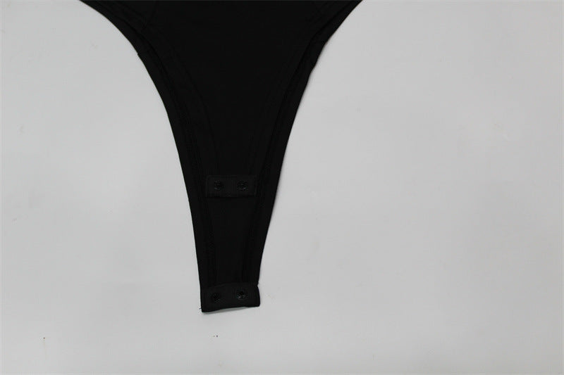 Black lingerie thong with adjustable button closure, designed for comfort and style.