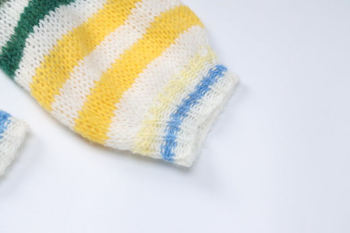 Colorful striped hand-knit sleeves in yellow, green, and blue hues, perfect for cozy evening wear.