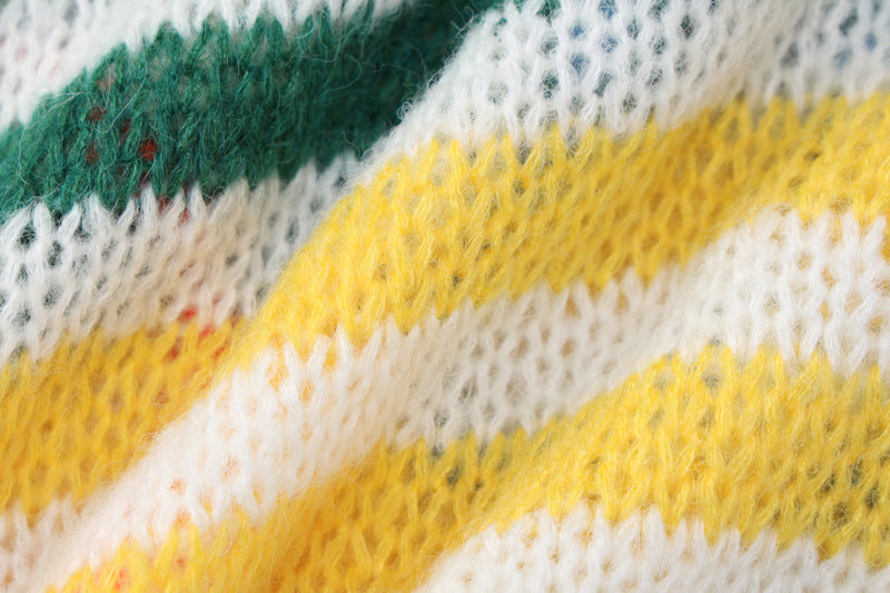 Cozy knitted fabric in green, white, and yellow stripes, perfect for loungewear or nightwear.