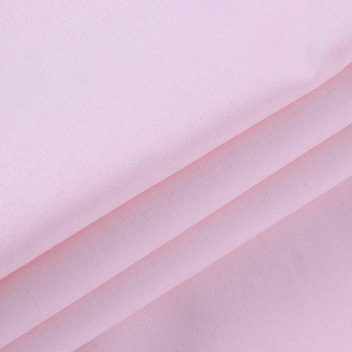 Soft pink fabric, showcasing smooth texture, ideal for lingerie and nightwear.