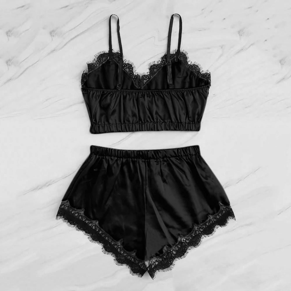 Black satin lingerie set featuring a lace-trimmed bralette and matching shorts, perfect for stylish comfort.