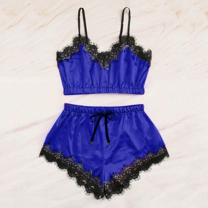 Two-piece lace-trimmed lingerie set featuring a royal blue crop top with black lace detailing and matching shorts with a scalloped hem.