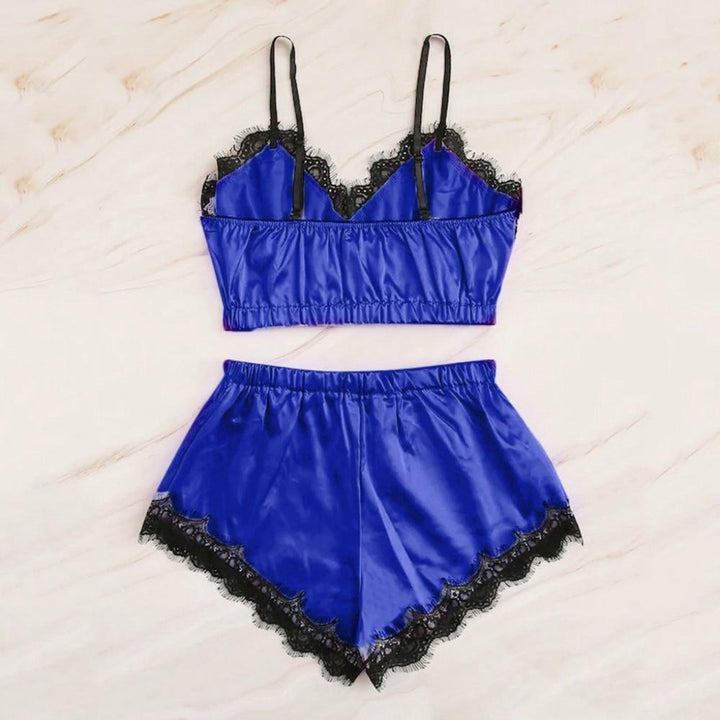 Blue satin lingerie set featuring a cropped bralette with black lace trim and matching high-waisted shorts.