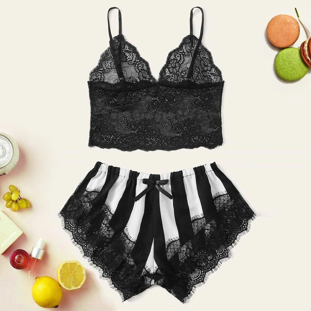 Black lace bralette and striped shorts set with lace trim, styled with accessories on a soft background.