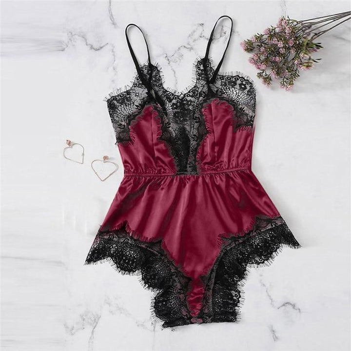 Burgundy satin lingerie bodysuit with black lace detailing and adjustable straps, perfect for intimate occasions.