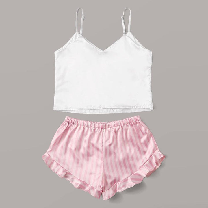 White satin camisole top with adjustable straps paired with pink striped satin shorts featuring a frilled hem. Ideal for a comfortable and stylish sleepwear set.