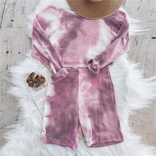 Women's tie-dye long sleeve crop top and matching shorts set in soft pink and white hues, perfect for lounging or casual wear.