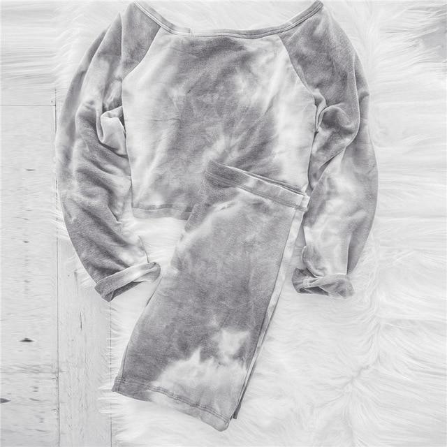 Cozy gray tie-dye lounge set featuring a cropped long-sleeve top and matching pants, perfect for casual or lounging wear.