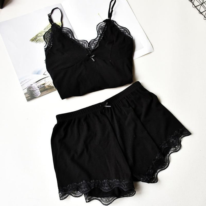 Black lace-trimmed lingerie set featuring a sleeveless top and matching shorts, perfect for sleepwear or loungewear.