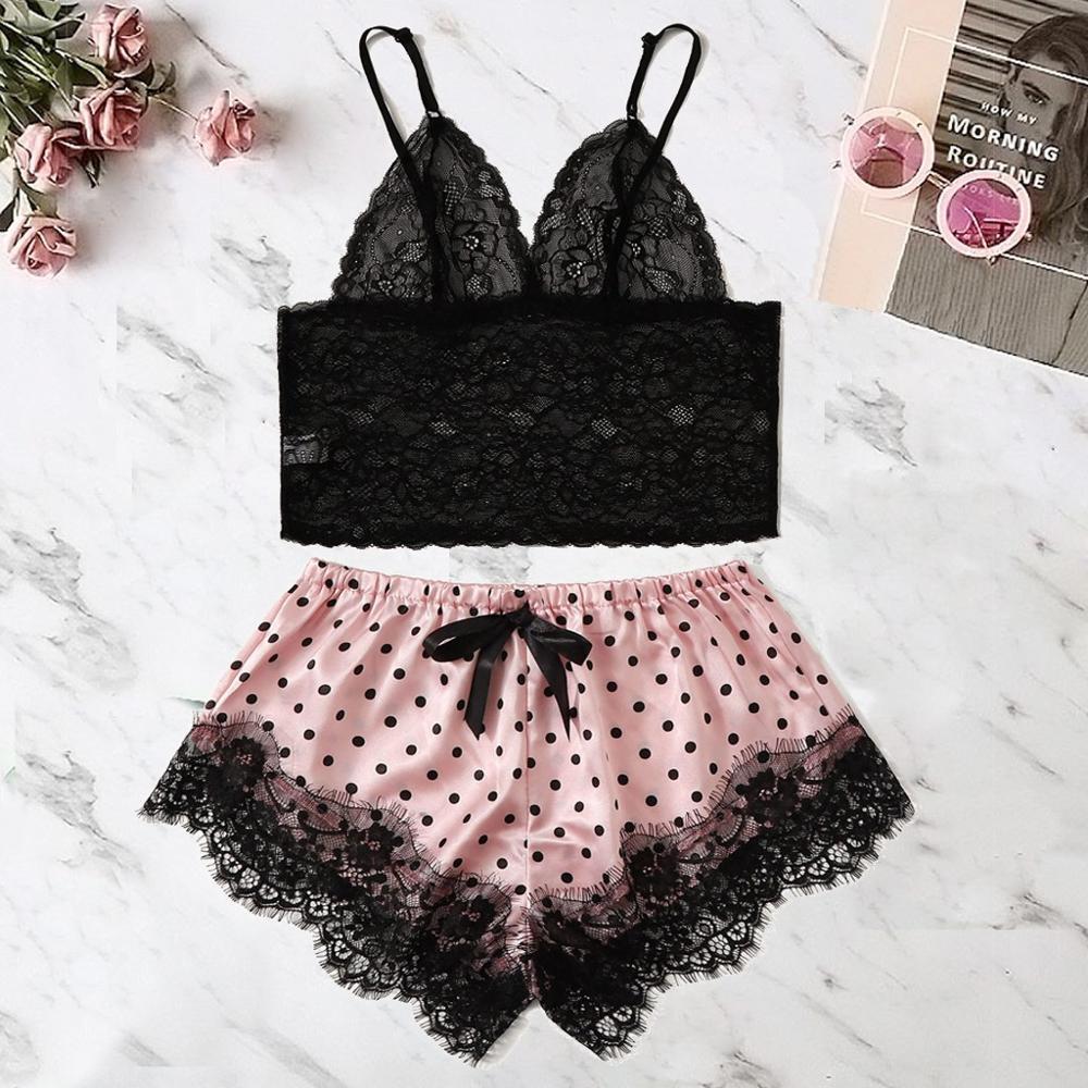 Black lace bralette and pink polka dot shorts set with black lace trim and waistband bow, perfect for stylish sleepwear or lounging.