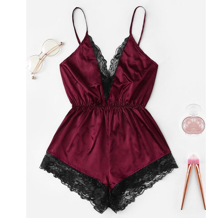 Burgundy satin lace-trimmed romper with adjustable straps, perfect for loungewear or evening wear.