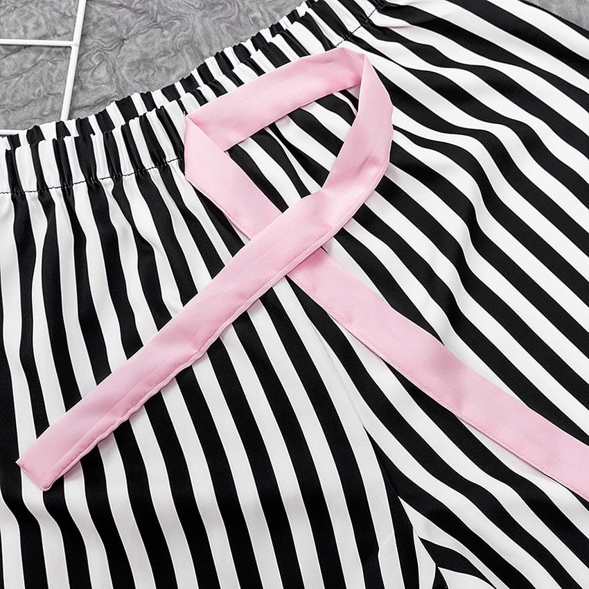 Black and white striped satin shorts with a soft pink ribbon detail.