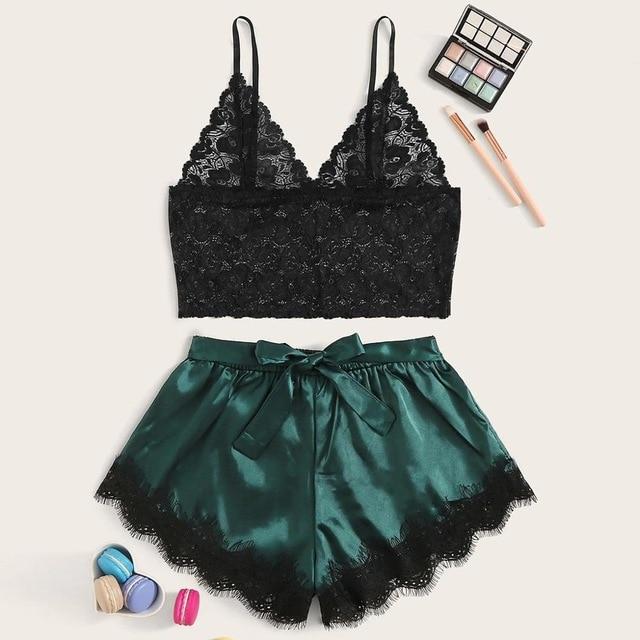 Lace bralette and satin shorts set in black and emerald green, perfect for elegant nightwear.