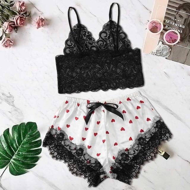 Lace bralette and heart-print shorts set with black lace trim for a seductive and cozy look.