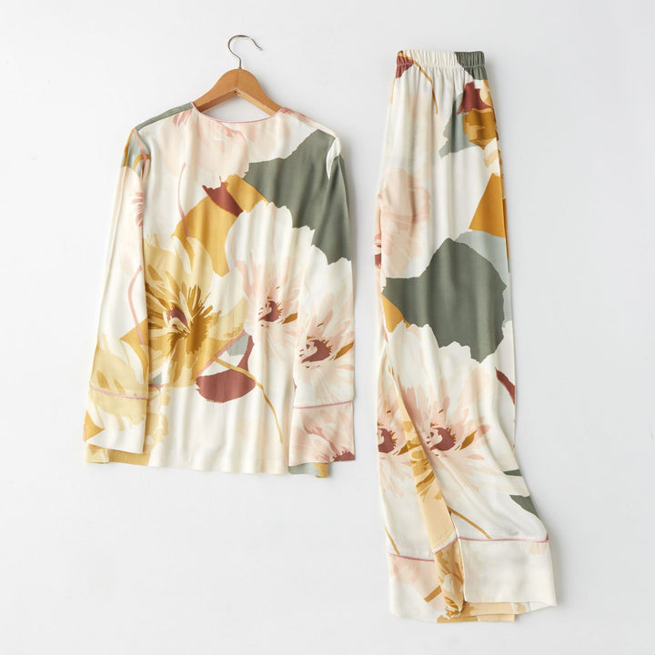 Long-sleeve floral print loungewear set featuring a relaxed top and matching pants, perfect for cozy nights in.