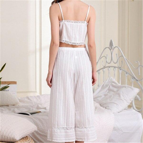 White lace-trimmed cropped top and wide-leg pajama set, featuring a relaxed fit, perfect for comfortable lounging.