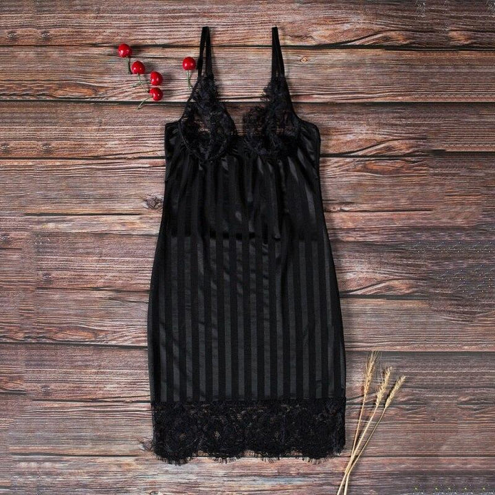 Black satin nightdress with lace detailing and vertical stripes, perfect for a luxurious evening look.