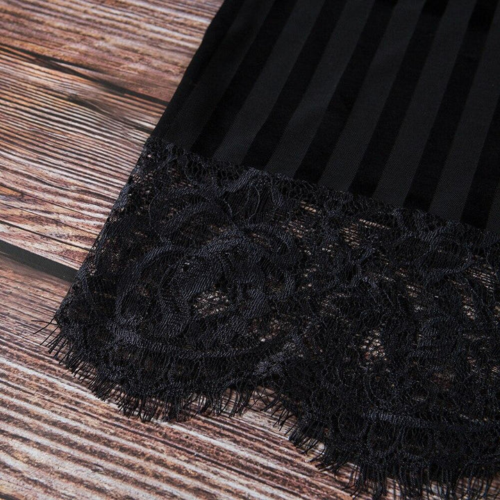 Black lace trim detailing on a striped satin fabric, showcasing a luxurious lingerie design.