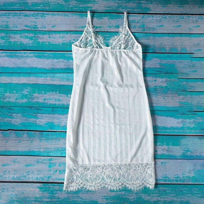 Lace-trimmed white nightgown with adjustable straps and subtle striped design, featuring delicate lace at the hem.